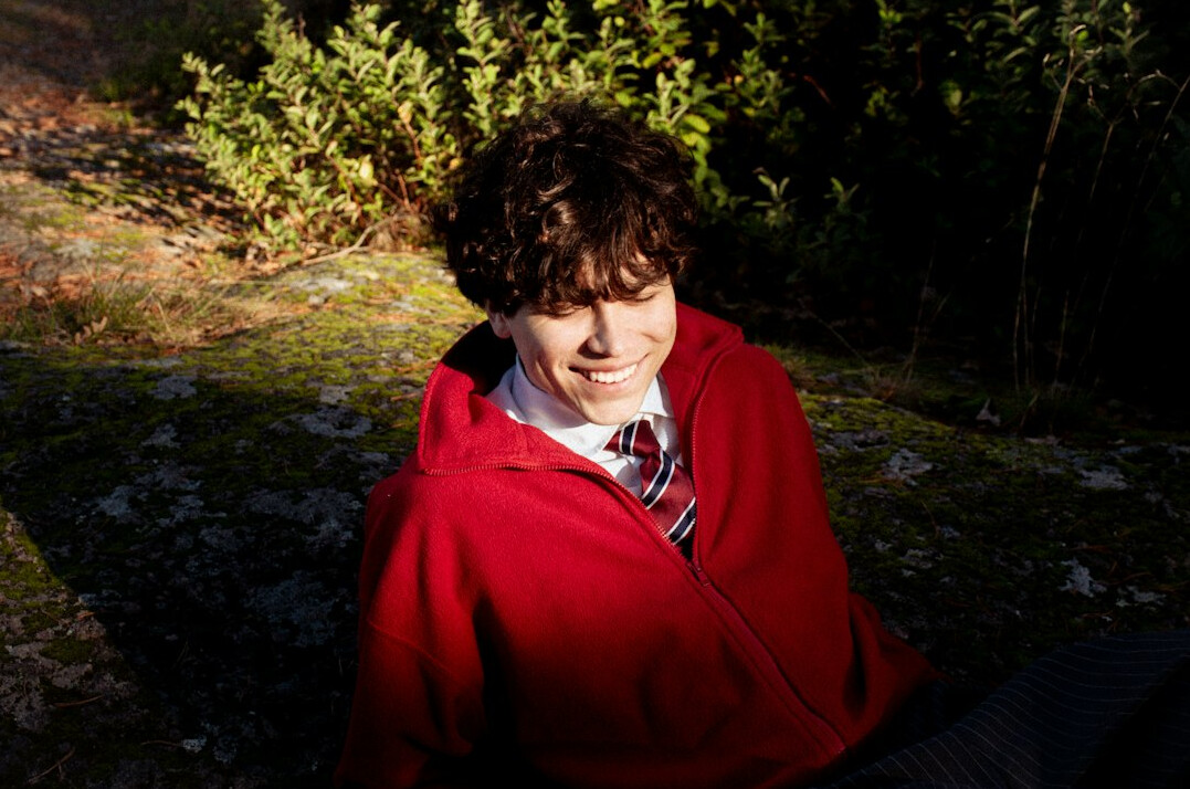 Smiling young man portrait outdoors